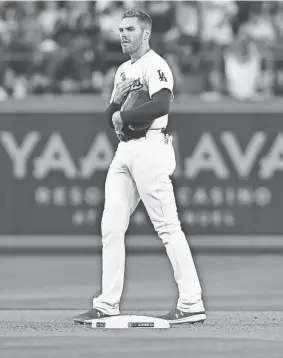  ?? GARY A. VASQUEZ/USA TODAY SPORTS ?? Los Angeles Dodgers first baseman Freddie Freeman acknowledg­es the fans during the eighth inning at Dodger Stadium.