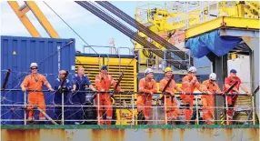  ?? AFP ?? Staff of Ndeavor, left, on board the vessel (below) brace for a UN-led operation to remove oil from the FSO Safer.