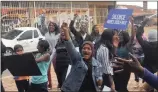  ?? PICTURE: JANINE MOODLEY ?? People celebrate outside the Verulam Family Court after a stepfather accused of rape was denied bail on Friday.