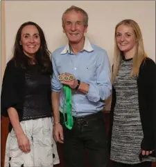  ??  ?? Leinster bronze over 35 masters team winners Carol Costello, Laura McCann (in absentia Helen Barry) are presented with their medals by Terry Kavanagh.