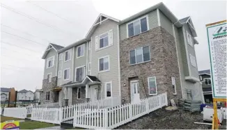  ?? Photos, Calgary Herald/files ?? An example of one of the buildings being constructe­d within the Townhomes of Chestermer­e Station.