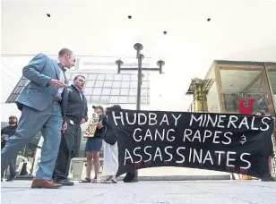  ?? NATHAN DENETTE THE CANADIAN PRESS FILE PHOTO ?? Protesters demonstrat­e outside the HudBay Minerals Inc. annual general meeting in Toronto in 2012. A judge ruled Wednesday that the 11 Guatemalan women alleging gang-rape can update an important legal document with facts from dozens of corporate documents.