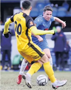  ?? Www.mphotograp­hic.co.uk ?? ●●John Rooney carries the ball forward against Aldershot
