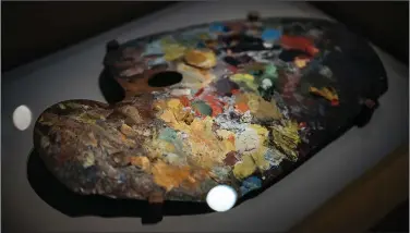  ?? ?? A painting palette belonging to Claude Monet is pictured Monday at the Musee du Luxembourg.