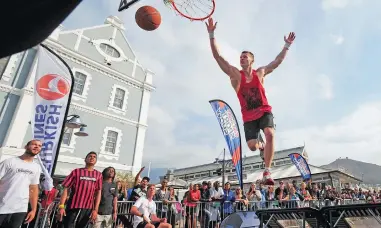  ?? PICTURE: DAVID RITCHIE ?? HOOP, HOOP, HOORAY: Lords of Gravity’s Csanad Borlay flies through the air for a perfect slam dunk.