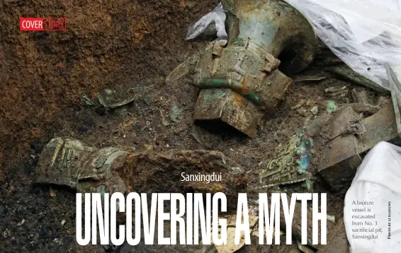  ??  ?? A bronze vessel is excavated from No. 3 sacrificia­l pit, Sanxingdui