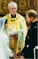  ?? (Pool photo via aP) ?? eXCHanGe VOWs – Prince Harry and meghan markle exchange vows during their wedding ceremony at st. George’s Chapel in Windsor Castle in Windsor, near London, england, saturday.