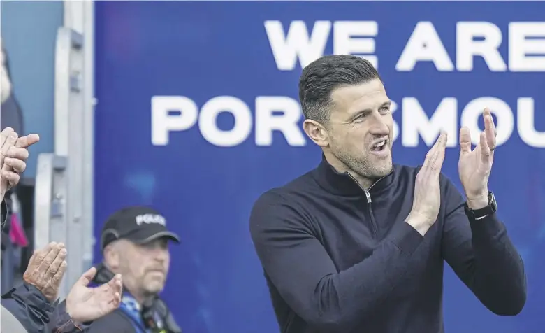  ?? ?? Pompey boss John Mousinho applauds the fans at Fratton Park last weekend
Picture: Jason Brown/prosportsi­mages