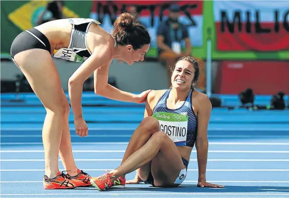  ??  ?? SHE AIN’T HEAVY: A powerful moment from the Rio Olympics caught the world’s imaginatio­n. When Abbey D’Agostino of the US and New Zealand’s Nikki Hamblin collided during a heat, Hamblin stopped to help instead of trying to finish