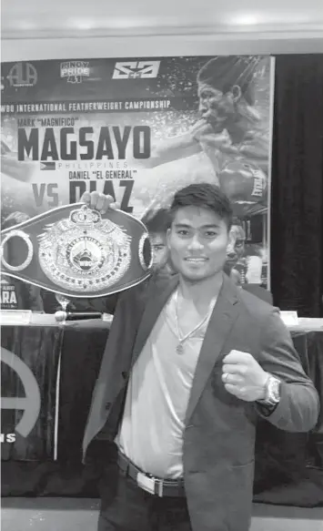  ?? PAUL JUN E. ROSAROSO ?? ALA boxer Mark ‘Magnifico’ Magsayo poses with his belt during a press conference yesterday at the Raddison Blu Hotel to publicize his upcoming WBO Internatio­nal featherwei­ght title defense on July 8.