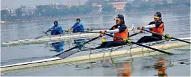  ??  ?? Rowers in action in the finals of at the all-India inter-university rowing championsh­ips held at the Hussainsag­ar Lake in Hyderabad.