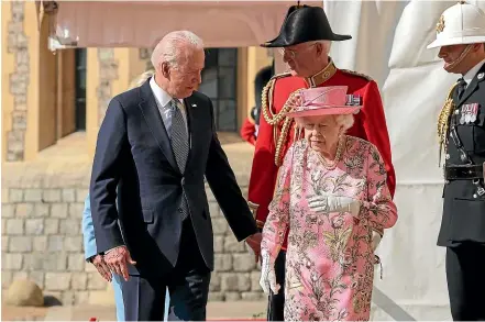  ?? AP ?? Queen Elizabeth II walks with US President Joe Biden during his visit to Windsor Castle.