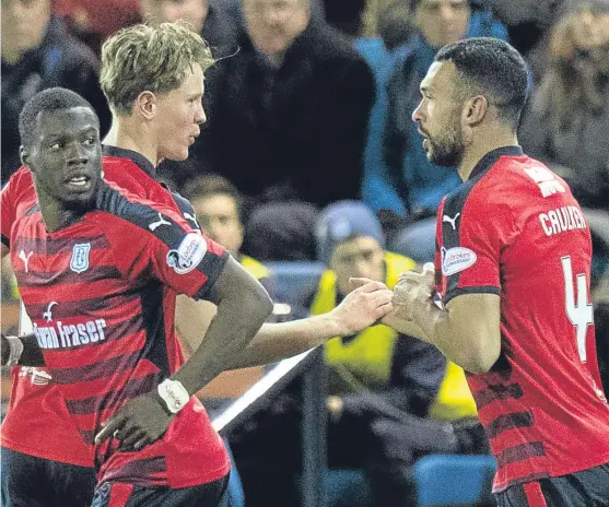  ?? Picture: SNS Group. ?? Dundee debutant Steven Caulker celebrates his goal with Mark O’Hara.