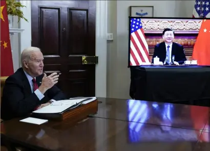  ?? Susan Walsh/Associated Press ?? President Joe Biden meets virtually with Chinese President Xi Jinping from the Roosevelt Room of the White House in Washington, on Nov. 15, 2021.