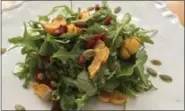  ?? PHOTO COURTESY OF BIBBY GIGNILLIAT ?? Arugula, roasted delicata squash, pepitas and goji berries give this healthy, vegan salad plenty of flavor.