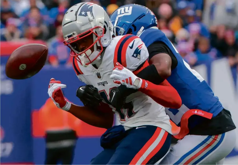  ?? MATTHEW J. LEE/GLOBE STAFF ?? Patriots speedy wide receiver Tyquan Thornton (2 catches on 5 targets for 19 yards) could not haul in this pass against Giants defensive back Adoree’ Jackson in the first quarter.