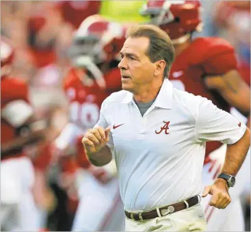  ?? Butch Dill/AP File ?? Alabama head coach Nick Saban is hoping to best former Roll Tide leader Bear Bryant.