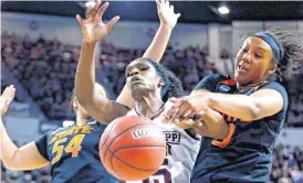  ?? [AP PHOTO] ?? Mississipp­i State center Teaira McCowan (15) battles Oklahoma State center Kaylee Jensen (54) and forward Mandy Coleman (3) for a loose ball during Monday’s round-two game.
