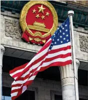  ?? DOUG MILLS / THE NEW YORK TIMES 2017 ?? The American flag flies outside the Great Hall of the People in Beijing during a welcome ceremony in November for President Donald Trump and first lady Melania Trump.