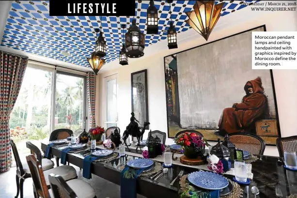  ??  ?? Moroccan pendant lamps and ceiling handpainte­d with graphics inspired by Morocco define the dining room.