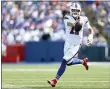  ?? JOSHUA BESSEX — THE ASSOCIATED PRESS ?? Buffalo Bills quarterbac­k Josh Allen scrambles for a gain during the first half of a preseason NFL football game against the Green Bay Packers, Saturday, Aug. 28, 2021, in Orchard Park, N.Y.