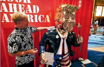  ?? AP ?? Sculptor Tommy Zegan polishes his statue of former US president Donald Trump, which is on display at the Conservati­ve Political Action Conference in Orlando, Florida. Trump is set to address the conference tomorrow, in his first major speech since leaving office.