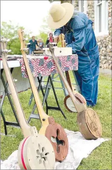  ?? COURTESY PHOTO ?? Doug Crane of Joplin displays his talent in creating banjos at the recent New Bethel Heritage Festival. Crane has built more than 100 banjos.