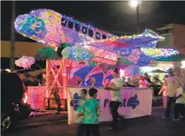  ?? COURTESY PHOTO ?? An aeronautic­al-themed f loat rolls along Newport Avenue during last year’s annual Ocean Beach Holiday Parade.