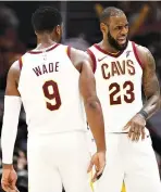  ??  ?? LEBRON JAMES of the Cleveland Cavaliers reacts to a foul cal with Dwyane Wade while playing the Chicago Bulls during a pre season game at Quicken Loans Arena on Oct. 10 in Cleveland, Ohio.