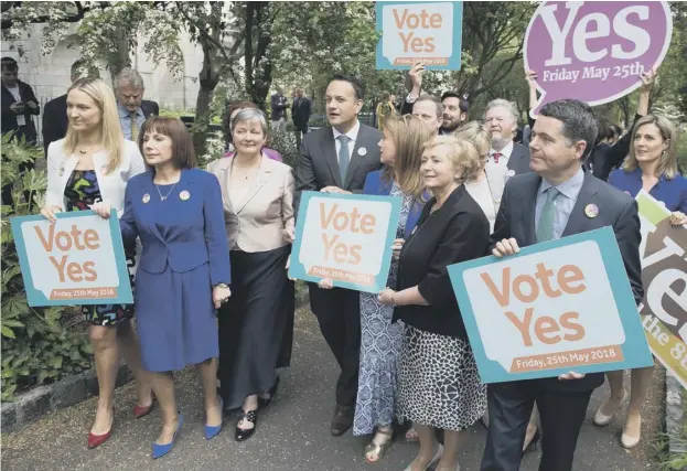  ??  ?? 0 Activists from the ‘Yes’ campaign, urging people to vote ‘yes’ in the referendum to repeal the eighth amendment of the Irish constituti­on