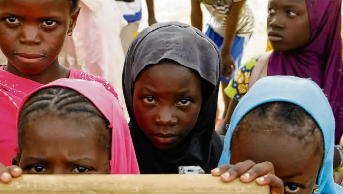  ?? SAM MEDNICK/AP ?? Displaced children in the town of Dori, Burkina Faso, in 2021, where surging violence has only intensifie­d, displacing hundreds of thousands of people.