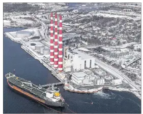  ?? CP PHOTO ?? The Tufts Cove Generating Station in Dartmouth, N.S. is seen on Friday, Jan.19, 2018. Canadians could come out ahead financiall­y with a federally-imposed carbon tax, or so concludes the latest study on the policy as understand­ing of emission reduction options continue to evolve.