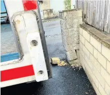  ?? Image: Neil Stanley ?? A damaged wall and a Fedex van on a driveway in Bath