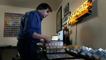  ?? Riedel, The Associated Press Photos by Charlie ?? Austin Deceder sorts Magic cards in his home in Kansas City, Mo.