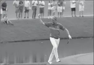  ?? The Associated Press ?? STRETCHING THE LEAD: Webb Simpson celebrates an eagle shot on the 11th hole during the third round of The Players Championsh­ip Saturday in Ponte Vedra Beach, Fla.