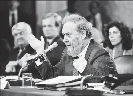  ?? JOSE R. LOPEZ / THE NEW YORK TIMES FILE (1987) ?? Judge Robert Bork makes a point during his Senate confirmati­on hearings in 1987 in Washington. Bork, a conservati­ve who was not seated on the court, advocated for a narrow interpreta­tion of the First Amendment, but recently, conservati­ves have used the...