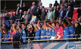  ?? ?? Harrison Burrows and the Peterborou­gh manager, Darren Ferguson, lift the EFL trophy at Wembley. Photograph: Adam Davy/PA