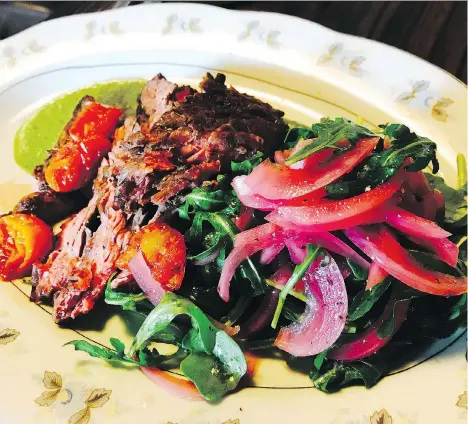  ??  ?? The mojo-marinated skirt steak at Tocador is juicy and flavourful. The sensuous dish is served with an arugula salad.