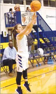  ?? Westside Eagle Observer/MIKE ECKELS ?? Lady Bulldog Abby Tilley takes a three-point shot from the right-wing during the Decatur-Yellville conference game in Decatur Jan. 28. Tilley hit a series of three 3-point field goals in the second half, enabling the Lady Bulldogs to tie the game and send it into overtime.