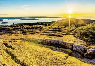  ?? GETTY IMAGES ?? Cadillac Mountain, located within Acadia National Park in Maine, is the first place in the United States to see the sun rise each day between early October and early March.