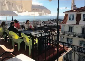  ??  ?? FOOD WITH A VIEW: In Lisbon, diners have breakfast on the rooftop terrace of the Cantina das Freiras with a view of the Tagus River.