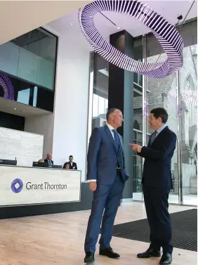  ??  ?? Jobs boost: Grant Thornton managing partner Michael McAteer and Finance Minister Paschal Donohoe