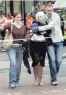  ?? GETTY IMAGES ?? An injured commuter is helped after several bomb blasts ripped across London’s undergroun­d network on July 7, 2005.