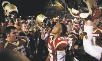  ?? Scott Strazzante / The Chronicle ?? Cardinal Newman’s Nikko Kitchen (center), who caught a second-half TD pass in last week’s victory over Rancho Cotate, was one of the players who lost their homes in the recent wildfires.