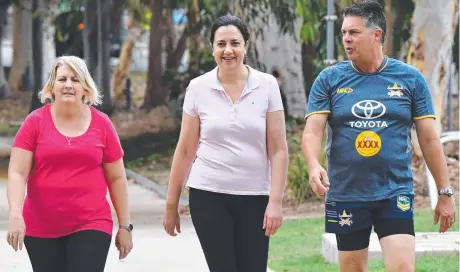  ??  ?? TEAM EFFORT: Member for Mundingbur­ra Coralee O'rourke, (left) Premier Annastacia Palaszczuk and member for Thuringowa Aaron Harper (right) take a walk through Riverside Park in Townsville,