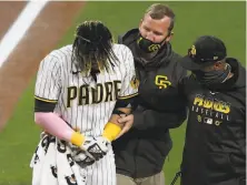  ?? Denis Poroy / Getty Images ?? Young shortstop Fernando Tatis Jr. was injured Monday, but the Padres are a team overshadow­ing S.F. in the division.