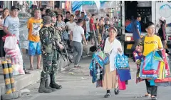  ?? EPA ?? Filipino soldiers stand guard on a street in Manila, Philippine­s, on Wednesday. According to news reports, government forces had been on heightened alert and security tightened.