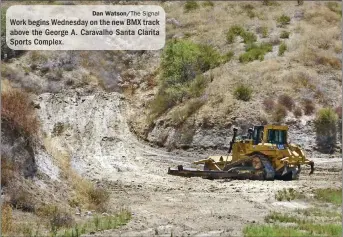  ?? Dan Watson/The Signal ?? Work begins Wednesday on the new BMX track above the George A. Caravalho Santa Clarita Sports Complex.