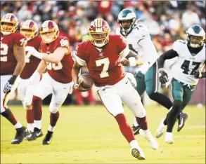  ?? Will Newton / Getty Images ?? The Redskins’ Dwayne Haskins runs against the Eagles.