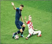  ?? (AFP) ?? France forward Olivier Giroud (left), fights for the ball with Croatia midfielder Ivan Rakitic during the Russia 2018 World Cup final football match between France and Croatia at the Luzhniki Stadium inMoscow on July 15.